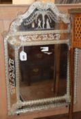 A Venetian engraved glass wall mirror H.74cm