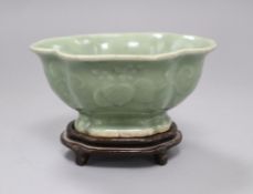 A Chinese celadon dish on stand