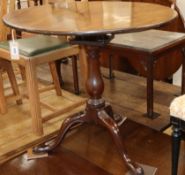 A George III mahogany tripod tilt top table with bird cage action W.77cm