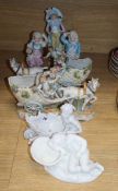 A pair of Continental porcelain horse and cart figures five eight others