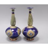 A pair of Royal Doulton stoneware bottle vases, early 20th century, with flame medallions on a