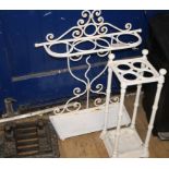 Two painted metal stick stands and a Victorian cast iron boot scraper