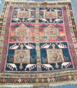 A Turkish red and blue rug 130 x 136cm