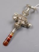 A late Victorian repousse silver child's rattle, with banded agate handle, six bells and a