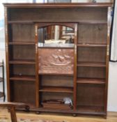 An early 20th century Arts & Crafts beech writing cabinet with embossed copper fall W.154cm