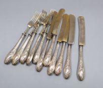 A set of five 800 standard handled fruit forks and six matching knives.