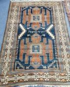 A Persian blue ground rug 125 x 185cm