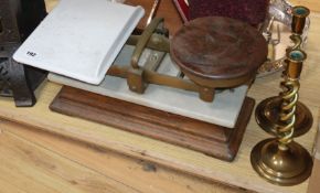 A cast iron conservatory heater, scales and brass candlesticks