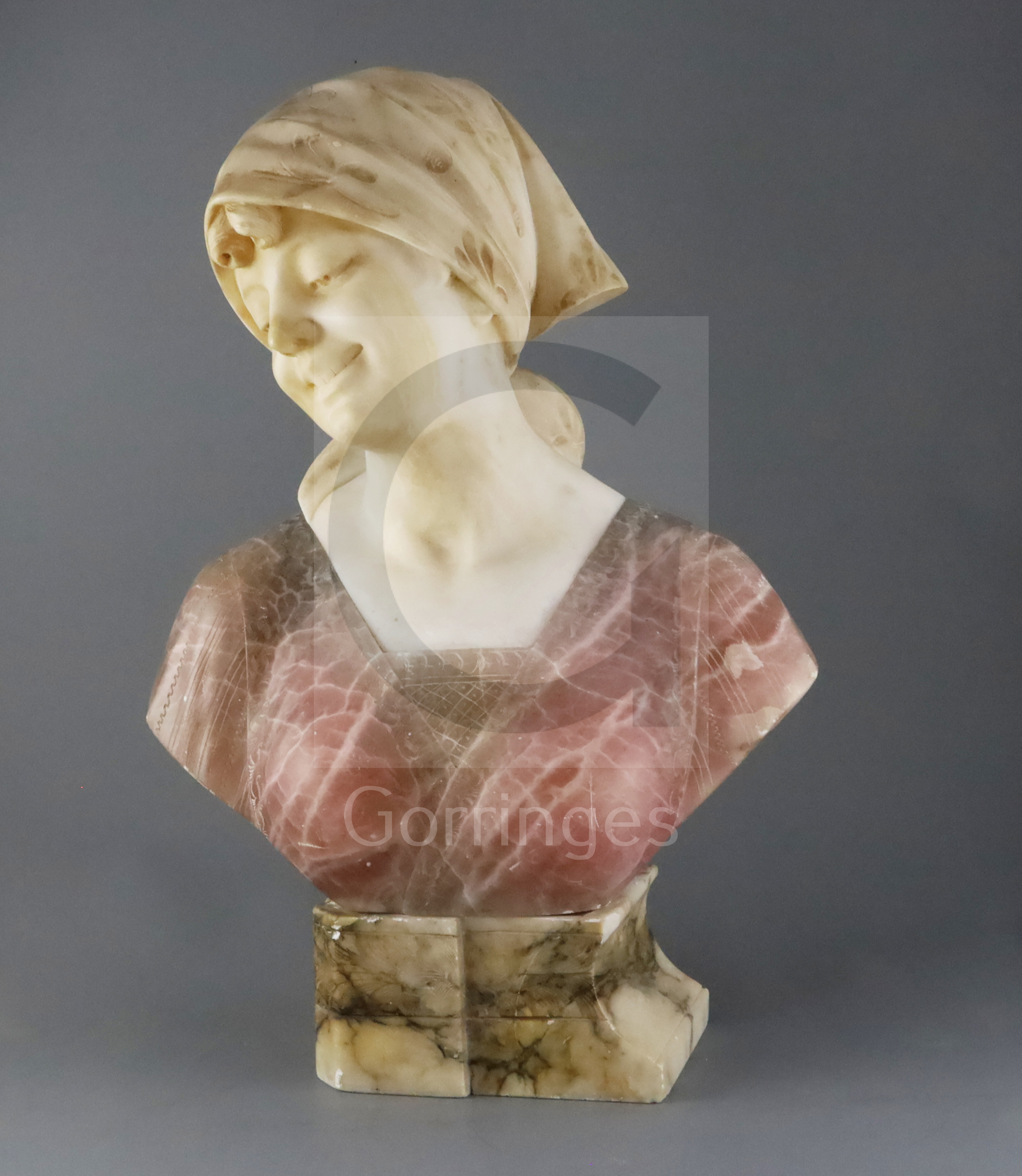 G. Pineschi (Italian c.1900). A carved alabaster and rose quartz bust of an Italian woman, signed,