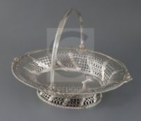 An early George III pierced silver oval bread basket, by Edward Aldridge, with engraved armorial and