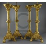 A set of four 19th century French Henri II style ormolu pricket candlesticks, decorated with