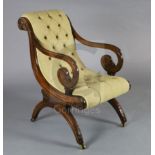 A good Regency mahogany library chair, in the manner of Thomas Hope, with button back and scroll