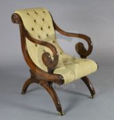 A good Regency mahogany library chair, in the manner of Thomas Hope, with button back and scroll