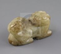 A Chinese pale celadon and brown jade group of a lion dog and cub, 18th / 19th century, L.6.3cm