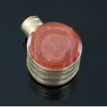 A small 19th century engraved gold and carnelian set moon shaped scent flask, one carnelian carved