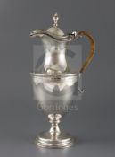 A late Victorian silver claret/hot water jug by Hawksworth, Eyre & Co, of vase form, with bright cut