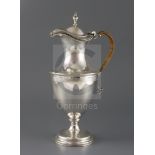 A late Victorian silver claret/hot water jug by Hawksworth, Eyre & Co, of vase form, with bright cut