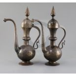 A pair of 19th century Qajar gold inlaid iron rosewater sprinklers, with spire finials and