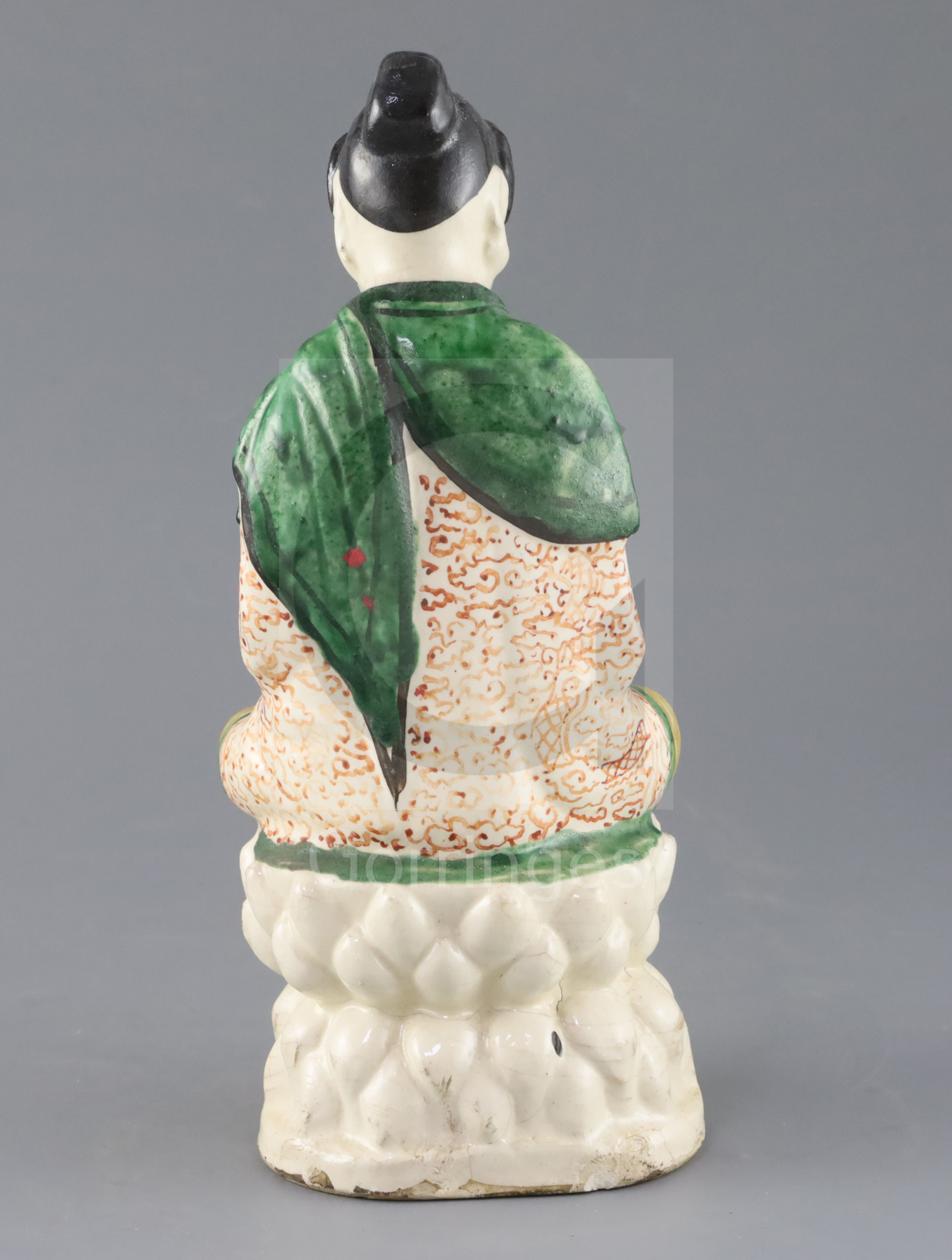 A Chinese Sancai glazed pottery seated figure of Guanyin, Qing dynasty, with scrollwork decoration - Image 2 of 3