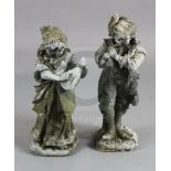 A pair of lead garden statues, modelled as a male horn player and female companion, H.1ft 10.5in.