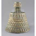 A 13th century Khorassan silver and copper inlaid bronze candlestick, of octagonal faceted truncated