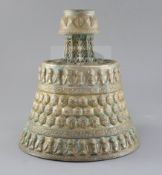 A 13th century Khorassan silver and copper inlaid bronze candlestick, of octagonal faceted truncated