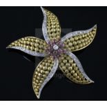 An 18ct gold, ruby and diamond set flower head pendant brooch, 55mm, gross 18 grams.