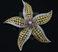 An 18ct gold, ruby and diamond set flower head pendant brooch, 55mm, gross 18 grams.