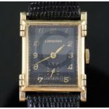 A gentlemans stylish 1930's 14k gold Longines manual wind wrist watch, with raised lugs and