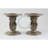 A pair of 19th century French F. Barbedienne bronze tazzae, with classical Greek head stems, W.6.
