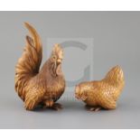 A Chinese boxwood figure of a cockerel and a similar of a hen, late 20th century, both with glass