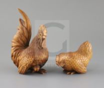 A Chinese boxwood figure of a cockerel and a similar of a hen, late 20th century, both with glass