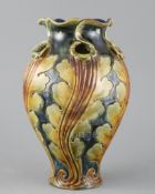 Frank A Butler for Doulton, a hand-built leaf design vase, c.1895, with wrythen modelled body and