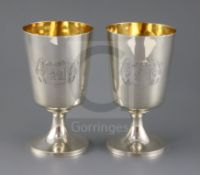 A pair of George III silver pedestal goblets, by Soloman Hougham?, of plain form with engraved