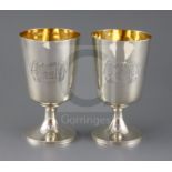 A pair of George III silver pedestal goblets, by Soloman Hougham?, of plain form with engraved