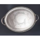 A Victorian silver oval two handled tea tray by Horace Woodward & Co, with engraved decoration and