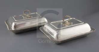 A pair of George V silver entree dishes, cover and handles, by Harrods Stores Ltd, of rectangular