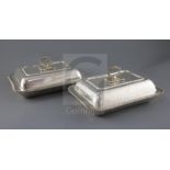 A pair of George V silver entree dishes, cover and handles, by Harrods Stores Ltd, of rectangular