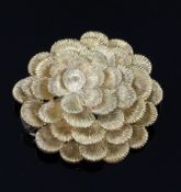 A 1960's Kutchinsky textured 18ct gold flower head clip brooch, signed en verso, 38mm.