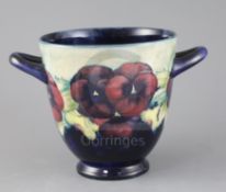 A William Moorcroft 'Pansy' jardiniere, c.1915, applied with a pair of looped handles, with a pale