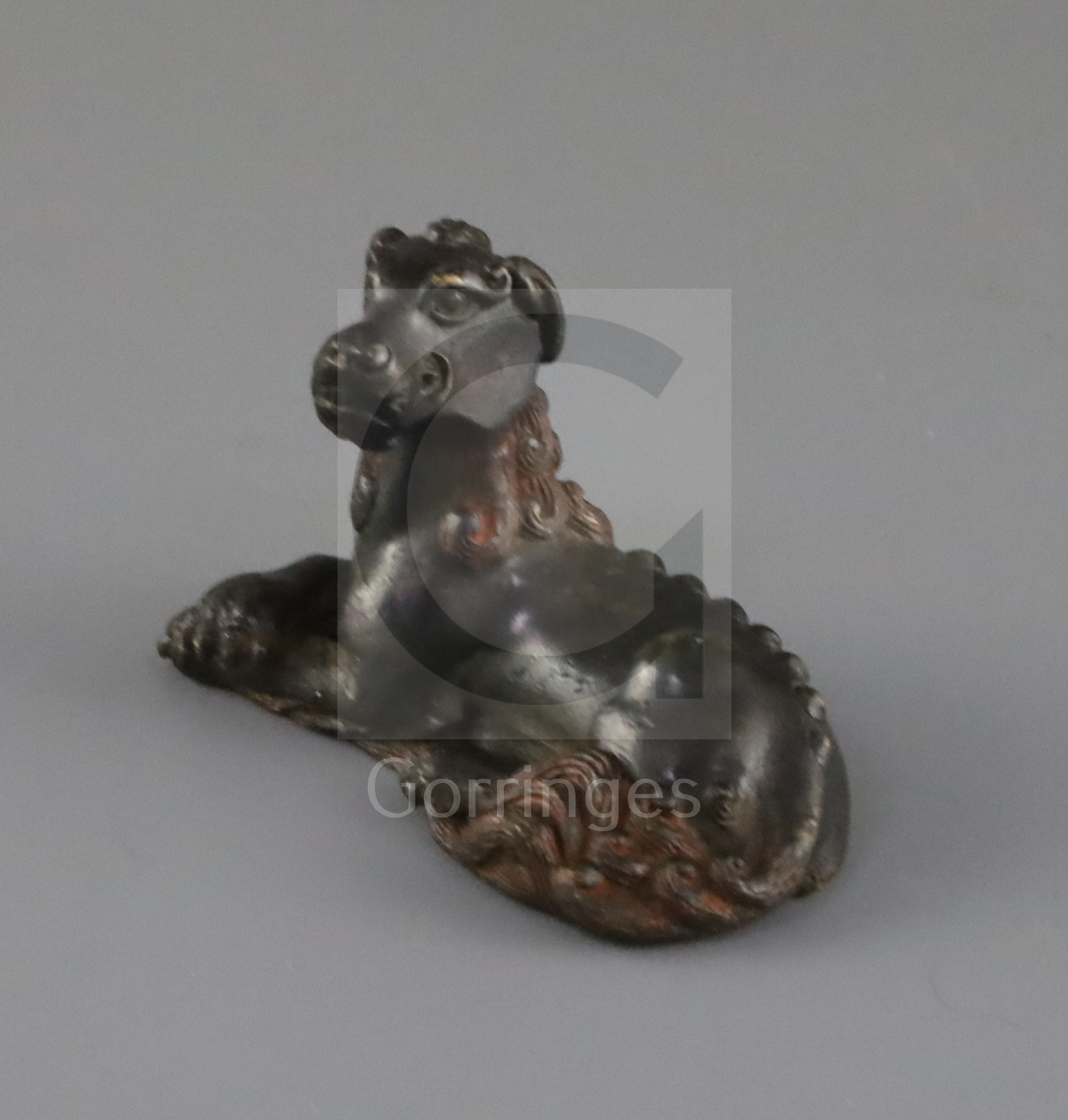 A Chinese bronze 'mythical beast' scroll weight, 17th / 18th century, the mythical beast with head
