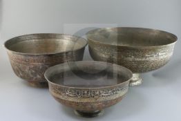 An 18th/19th century Persian tinned copper bowl, with inscribed and foliate decorated bands,