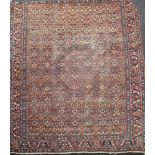 A Mahal red ground carpet, with field of geometric foliate motifs, 12ft 8in x 10ft 9in.