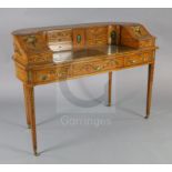 An Edwardian painted satinwood Carlton House desk, decorated with flowers and cameo portraits, the