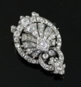 A Victorian gold, silver and old mine cut diamond set pendant brooch, of shaped oval form with