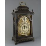John Dade of London. A George III ebonised pear wood bracket clock, the silvered and gilt arched