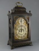 John Dade of London. A George III ebonised pear wood bracket clock, the silvered and gilt arched