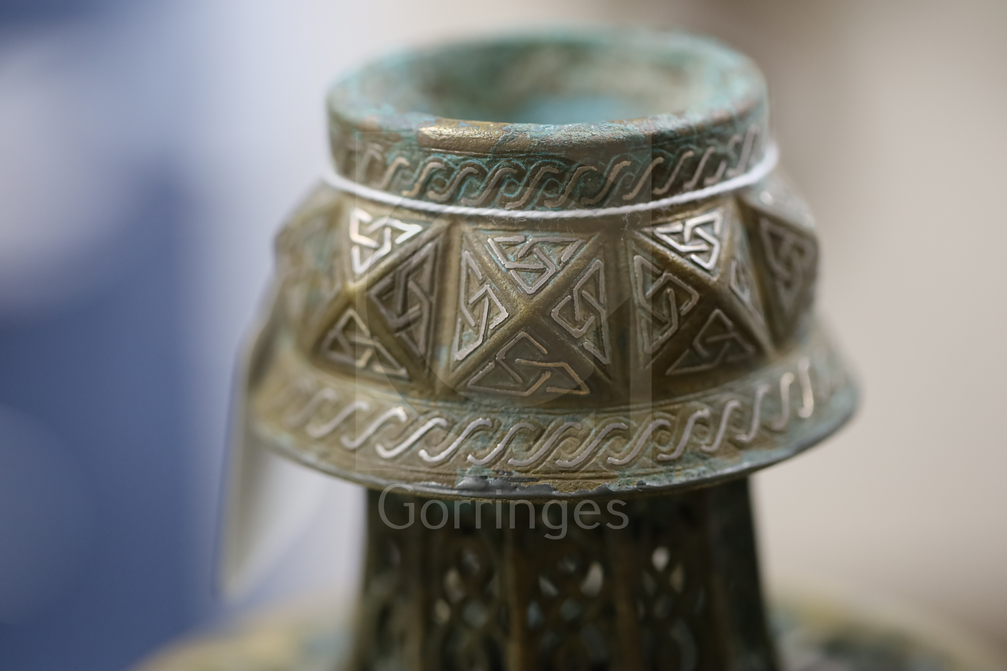 A 13th century Khorassan silver and copper inlaid bronze candlestick, of octagonal faceted truncated - Image 4 of 6