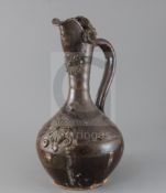 A Turkish Cannakale pottery ewer, 19th century, applied with medallions and scroll decoration and