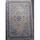 A Heriz ivory and blue ground carpet, with field of scrolling foliage and five row border, 13ft by